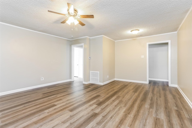 1316 Guthrie Dr, Waco, TX 76710 - empty room with ceiling fan, wood finished floors, a textured ceiling, baseboards, and ornamental molding