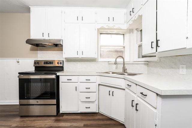 1316 Guthrie Dr, Waco, TX 76710 - kitchen with under cabinet range hood, stainless steel electric range, a sink, light countertops, and decorative backsplash