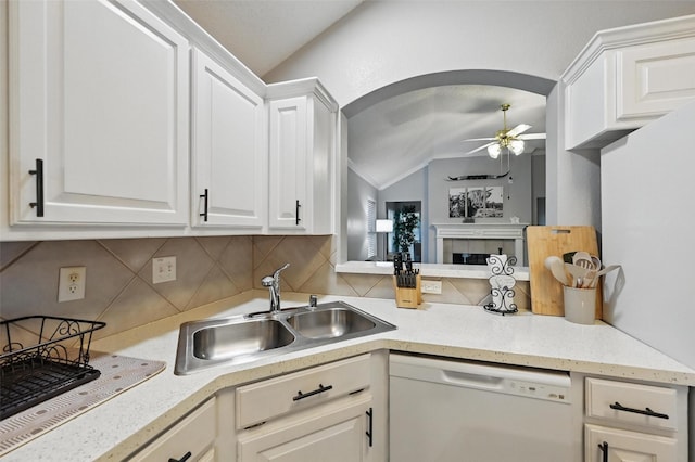 4525 Wheatland Dr, Fort Worth, TX 76179 - kitchen with white dishwasher, vaulted ceiling, ceiling fan, tasteful backsplash, and a sink