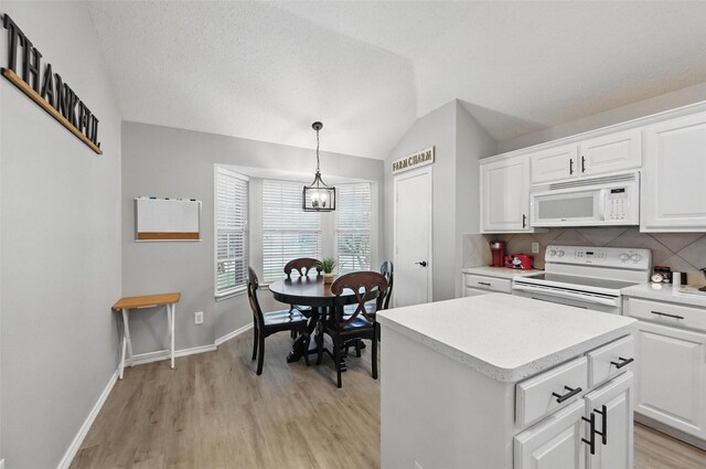 4525 Wheatland Dr, Fort Worth, TX 76179 - kitchen featuring white appliances, lofted ceiling, light wood finished floors, light countertops, and decorative backsplash