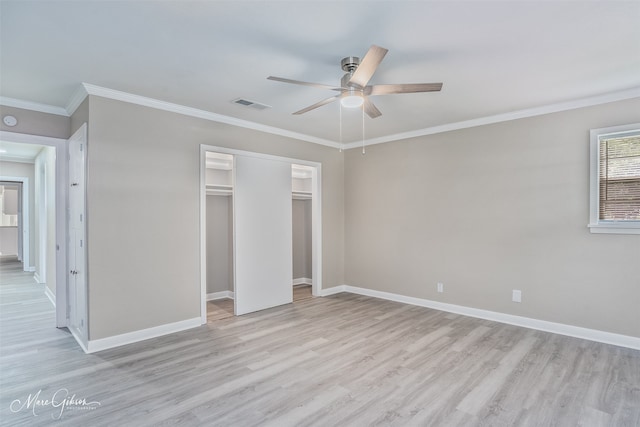 156 Charles Ave, Shreveport, LA 71105 - unfurnished bedroom with light wood-type flooring, crown molding, baseboards, ceiling fan, and a closet