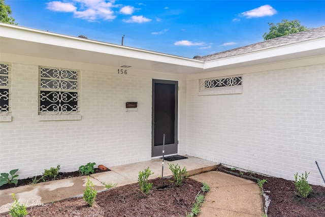 156 Charles Ave, Shreveport, LA 71105 - view of exterior entry featuring brick siding