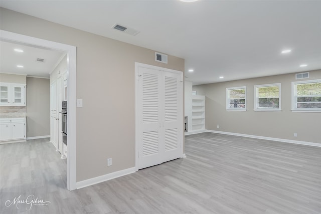 156 Charles Ave, Shreveport, LA 71105 - unfurnished living room featuring light wood-type flooring, baseboards, and recessed lighting