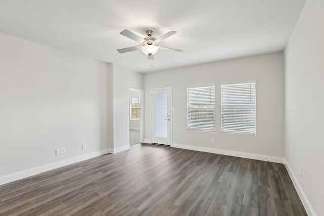 519 Willet Dr, Mckinney, TX 75069 - unfurnished room with dark wood-style flooring, a ceiling fan, and baseboards