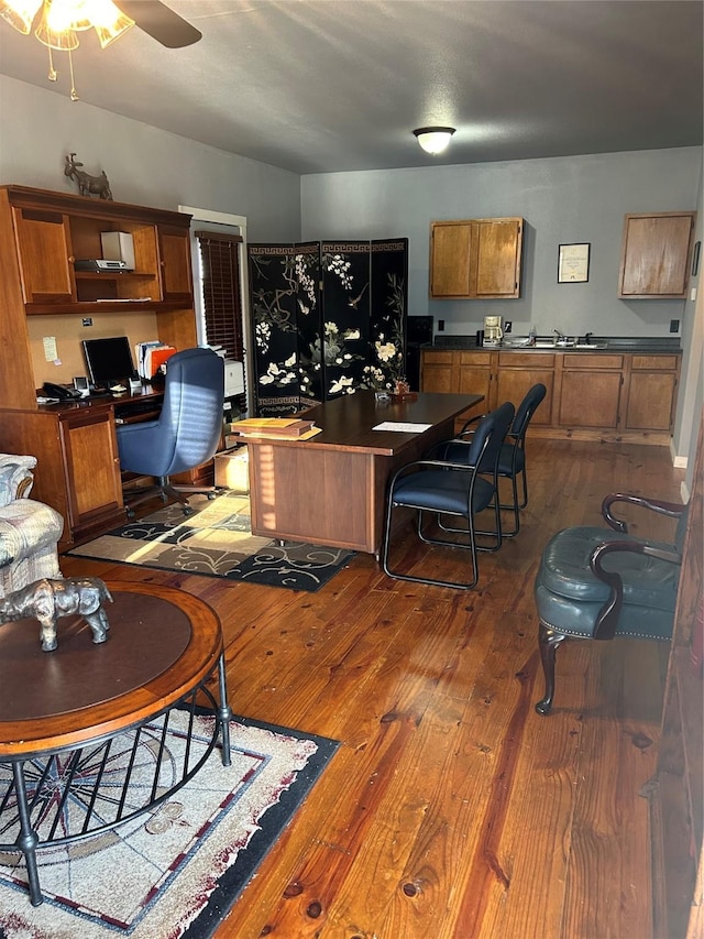 1004 Church St, Sulphur Springs, TX 75482 - office area featuring dark wood finished floors, ceiling fan, and a sink