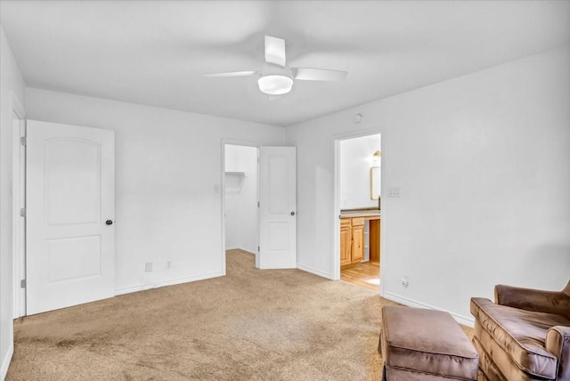 415 Lone Star Ln, Hideaway, TX 75771 - bedroom featuring light colored carpet, baseboards, a spacious closet, ensuite bathroom, and ceiling fan