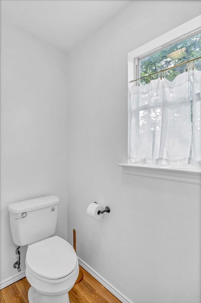 415 Lone Star Ln, Hideaway, TX 75771 - bathroom with healthy amount of natural light, wood finished floors, and baseboards