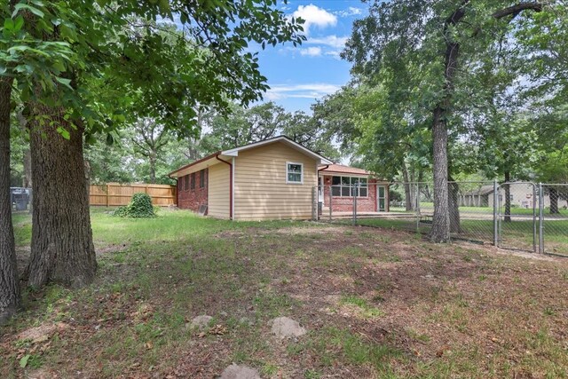 415 Lone Star Ln, Hideaway, TX 75771 - back of property with a gate