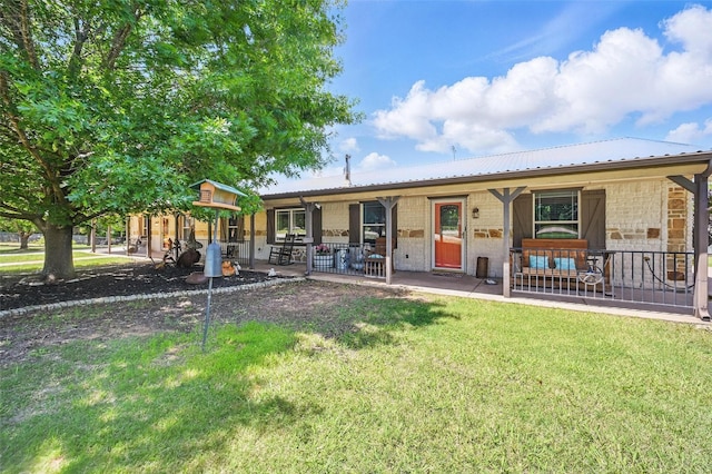 2800 E Fm 4, Cleburne, TX 76031 - view of front of property featuring a front yard, metal roof, covered porch, and stone siding