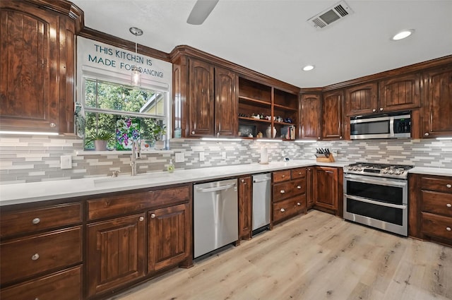 2800 E Fm 4, Cleburne, TX 76031 - kitchen with stainless steel appliances, a sink, open shelves, tasteful backsplash, and light wood-style floors