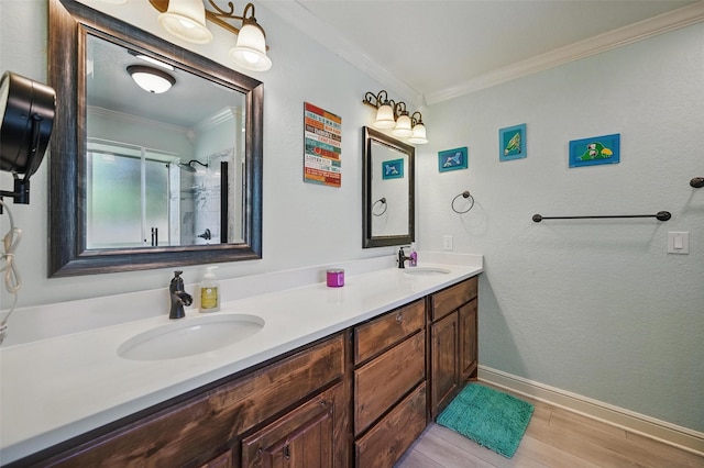 2800 E Fm 4, Cleburne, TX 76031 - full bath featuring ornamental molding, wood finished floors, double vanity, a shower with door, and baseboards