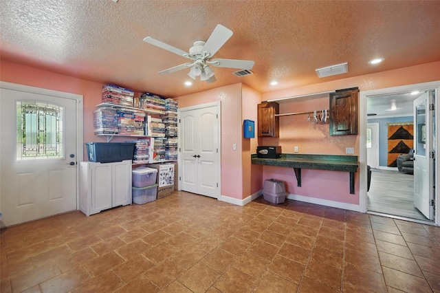 2800 E Fm 4, Cleburne, TX 76031 - kitchen featuring a textured ceiling, dark countertops, ceiling fan, recessed lighting, and baseboards