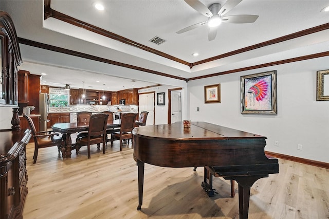 2800 E Fm 4, Cleburne, TX 76031 - living area featuring a tray ceiling, a ceiling fan, light wood-style floors, recessed lighting, and crown molding