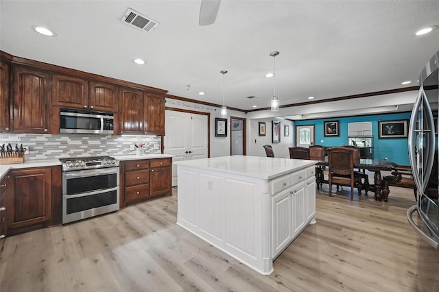 2800 E Fm 4, Cleburne, TX 76031 - kitchen featuring stainless steel appliances, light countertops, light wood finished floors, white cabinets, and a center island