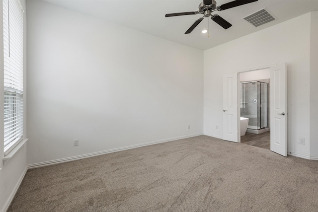 3104 Lakewood Bluffs Trl, Lewisville, TX 75010 - unfurnished bedroom with carpet floors, multiple windows, baseboards, ensuite bathroom, and recessed lighting