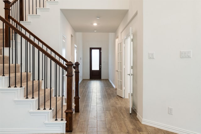 3104 Lakewood Bluffs Trl, Lewisville, TX 75010 - entryway with baseboards, stairway, and wood finished floors