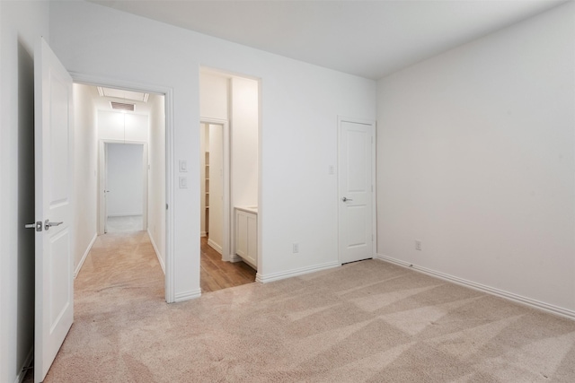 3104 Lakewood Bluffs Trl, Lewisville, TX 75010 - unfurnished bedroom featuring light colored carpet, baseboards, and connected bathroom