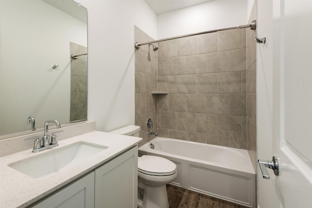 3104 Lakewood Bluffs Trl, Lewisville, TX 75010 - full bathroom featuring toilet, wood finished floors, bathing tub / shower combination, and vanity