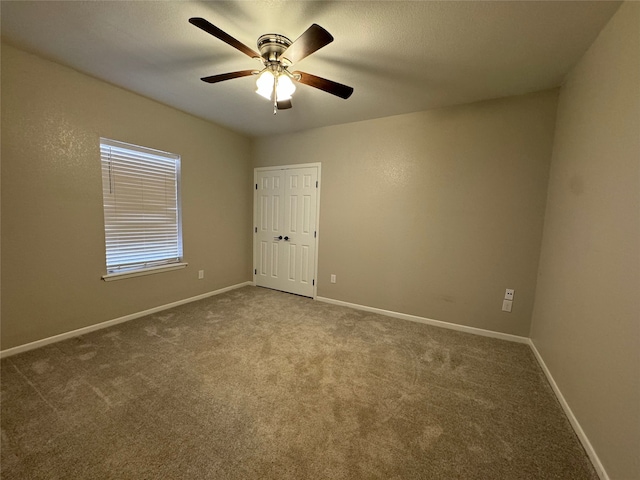 608 S Seaman St, Eastland, TX 76448 - carpeted empty room featuring ceiling fan and baseboards
