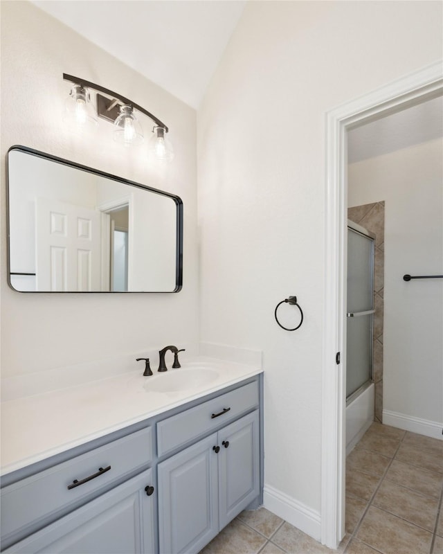 3517 Grants Lndg, Fort Worth, TX 76179 - bathroom with vanity, tile patterned flooring, baseboards, vaulted ceiling, and bath / shower combo with glass door