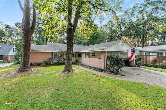 6237 Dillingham Ave, Shreveport, LA 71106 - ranch-style home featuring asphalt driveway, brick siding, and a carport