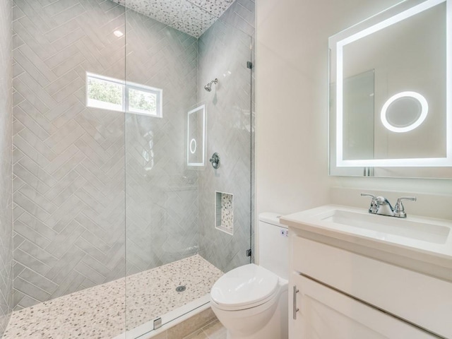 406 Barnes St, Mckinney, TX 75069 - bathroom featuring tiled shower, toilet, and vanity