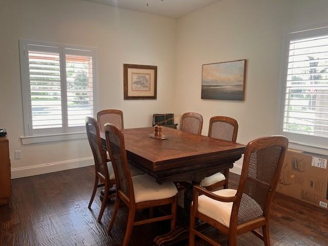 406 Barnes St, Mckinney, TX 75069 - dining area with dark wood finished floors, healthy amount of natural light, and baseboards
