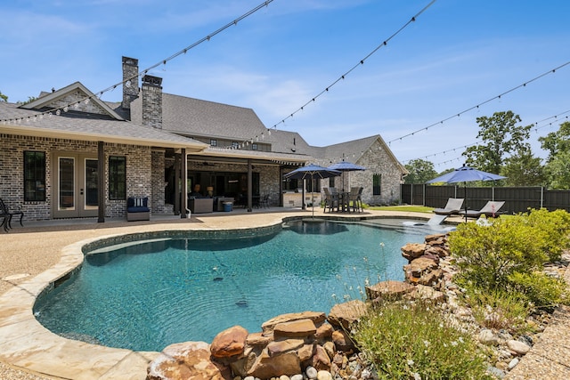 7404 Sandy Lake Rd, Quinlan, TX 75474 - view of swimming pool with french doors and a patio area
