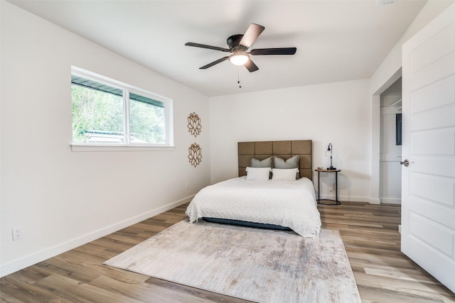 1106 Spring Lake Dr, Garland, TX 75043 - bedroom with wood finished floors, baseboards, and a ceiling fan