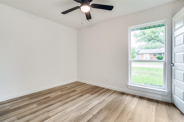 1106 Spring Lake Dr, Garland, TX 75043 - empty room with light wood-style flooring, baseboards, and ceiling fan