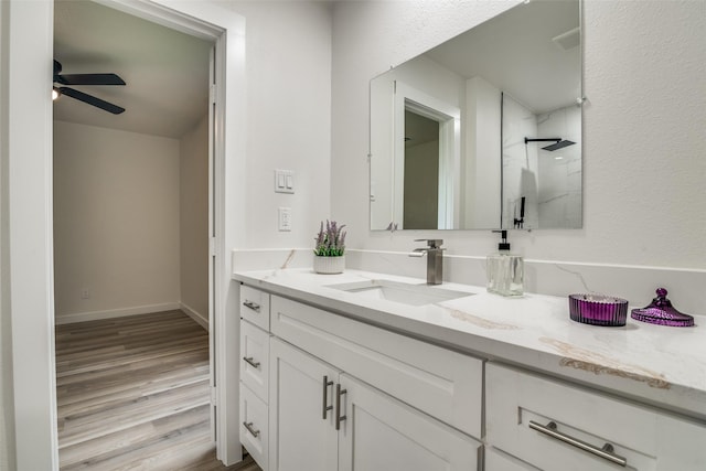 1106 Spring Lake Dr, Garland, TX 75043 - bathroom with a shower, vanity, wood finished floors, and ceiling fan