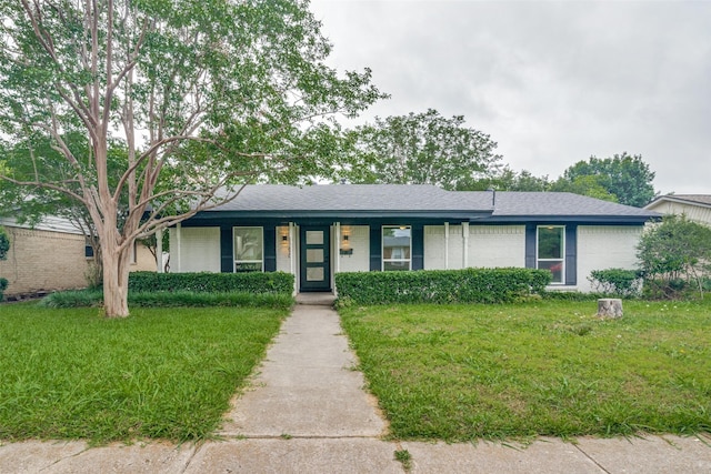1106 Spring Lake Dr, Garland, TX 75043 - ranch-style house featuring brick siding, a front yard, and covered porch
