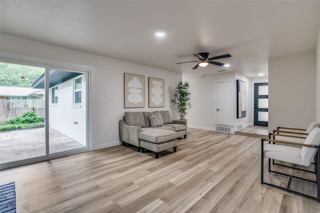 1106 Spring Lake Dr, Garland, TX 75043 - living room with light wood-style floors, baseboards, a ceiling fan, and recessed lighting