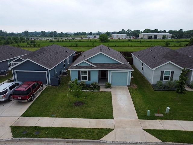723 Cochran Dr, Princeton, TX 75407 - single story home featuring an attached garage, concrete driveway, a front lawn, and cooling unit