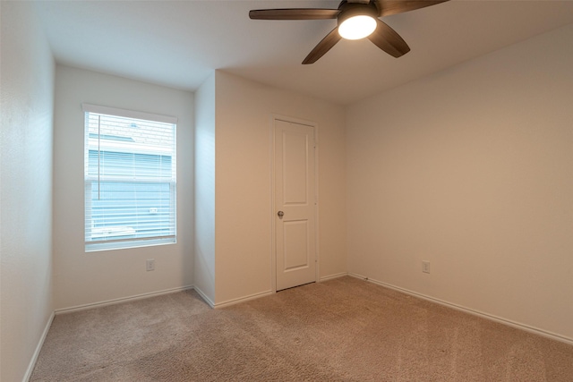 723 Cochran Dr, Princeton, TX 75407 - unfurnished bedroom with light colored carpet, baseboards, and ceiling fan