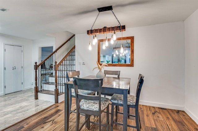 606 Quiram Ln, Kemp, TX 75143 - dining space with wood finished floors, stairs, and baseboards