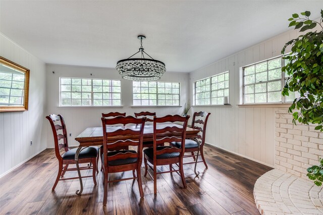 606 Quiram Ln, Kemp, TX 75143 - dining space with healthy amount of natural light, dark wood-type flooring, a chandelier, and baseboards