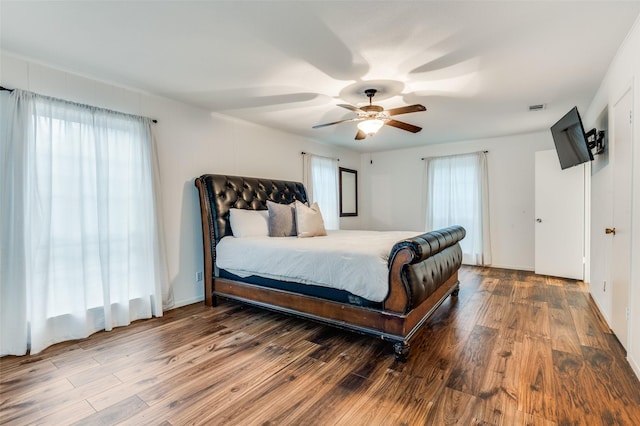 606 Quiram Ln, Kemp, TX 75143 - bedroom featuring multiple windows, wood finished floors, and ceiling fan