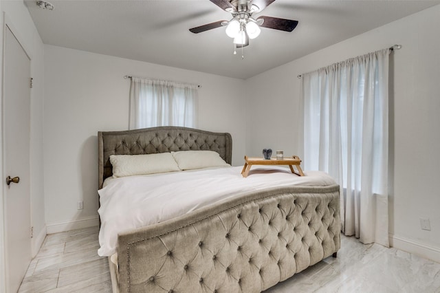 606 Quiram Ln, Kemp, TX 75143 - bedroom with baseboards and a ceiling fan