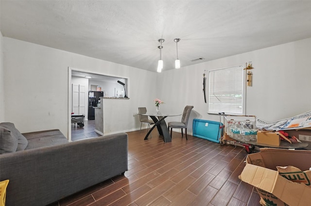 407 Mckinley St, Cedar Hill, TX 75104 - living room featuring dark wood-style flooring and baseboards