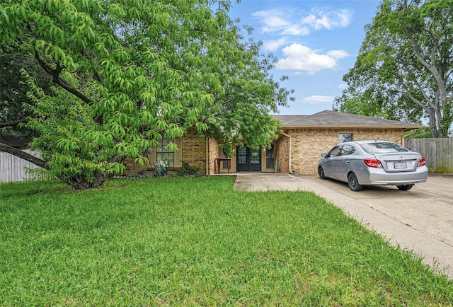 407 Mckinley St, Cedar Hill, TX 75104 - view of property hidden behind natural elements featuring french doors, brick siding, and driveway