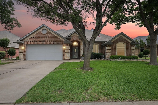 568 Willowview Dr, Saginaw, TX 76179 - view of front of house with brick siding, an attached garage, a lawn, and driveway