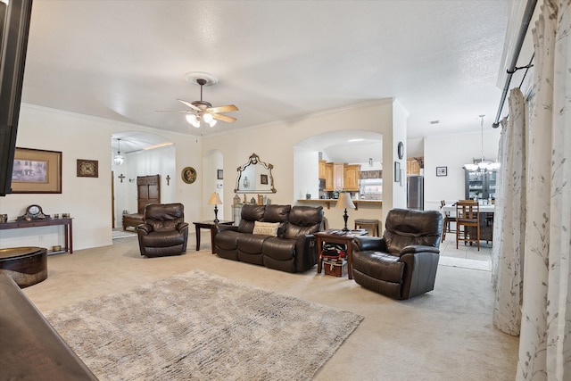 568 Willowview Dr, Saginaw, TX 76179 - living area featuring light colored carpet, arched walkways, ornamental molding, ceiling fan, and a chandelier