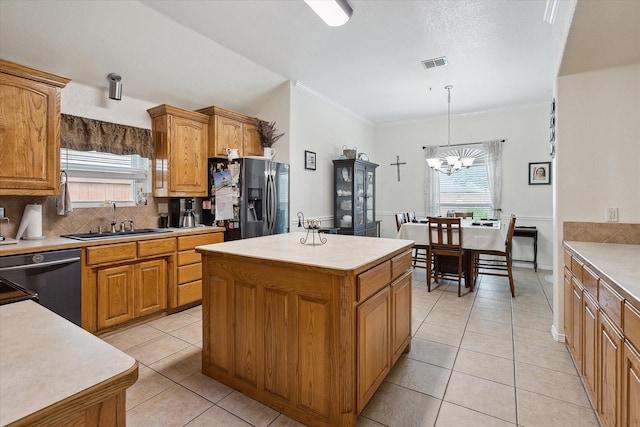 568 Willowview Dr, Saginaw, TX 76179 - kitchen with a sink, black fridge with ice dispenser, dishwasher, a center island, and tasteful backsplash