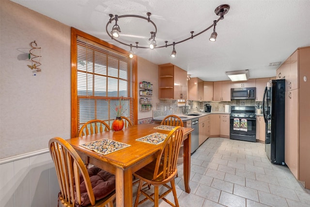 3245 Gail Ct, Irving, TX 75060 - dining space with a textured ceiling, light tile patterned floors, and track lighting