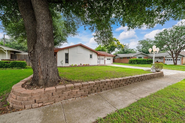 3245 Gail Ct, Irving, TX 75060 - view of property exterior with concrete driveway, an attached garage, and stucco siding