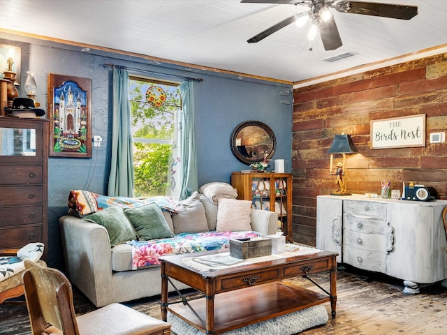 301 S Main St, Crandall, TX 75114 - living area with wood finished floors, a ceiling fan, and wooden walls