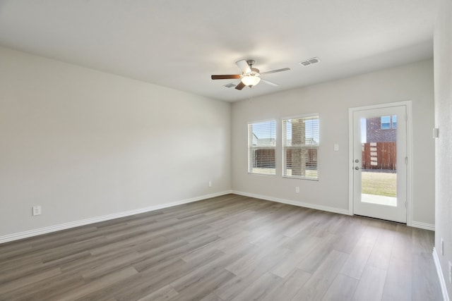511 Willet Dr, Mckinney, TX 75069 - unfurnished room with ceiling fan, wood finished floors, and baseboards