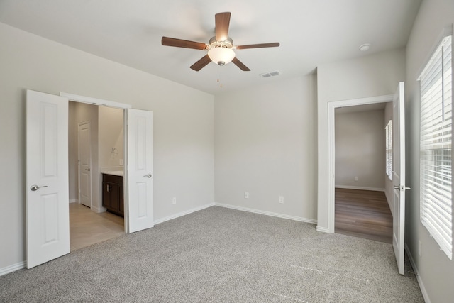 511 Willet Dr, Mckinney, TX 75069 - unfurnished bedroom with light carpet, baseboards, ensuite bath, and ceiling fan