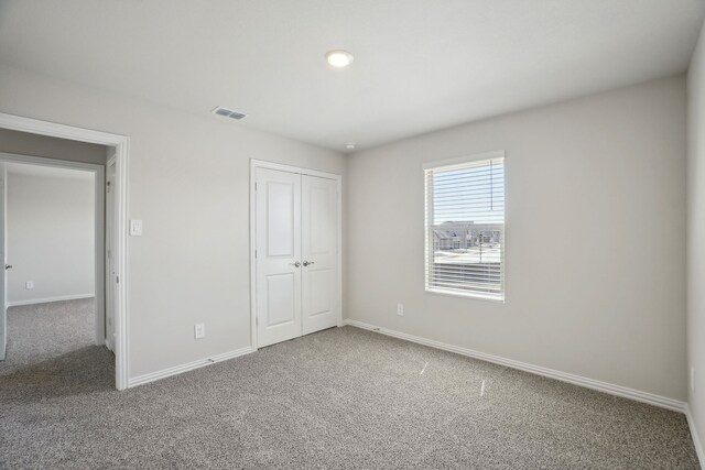 511 Willet Dr, Mckinney, TX 75069 - unfurnished bedroom with carpet floors, baseboards, and a closet